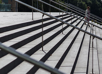 Street scene of woman descending stairs