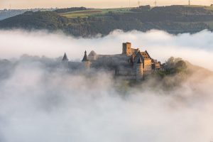 Bourscheid Castle in Luxembourg in fog